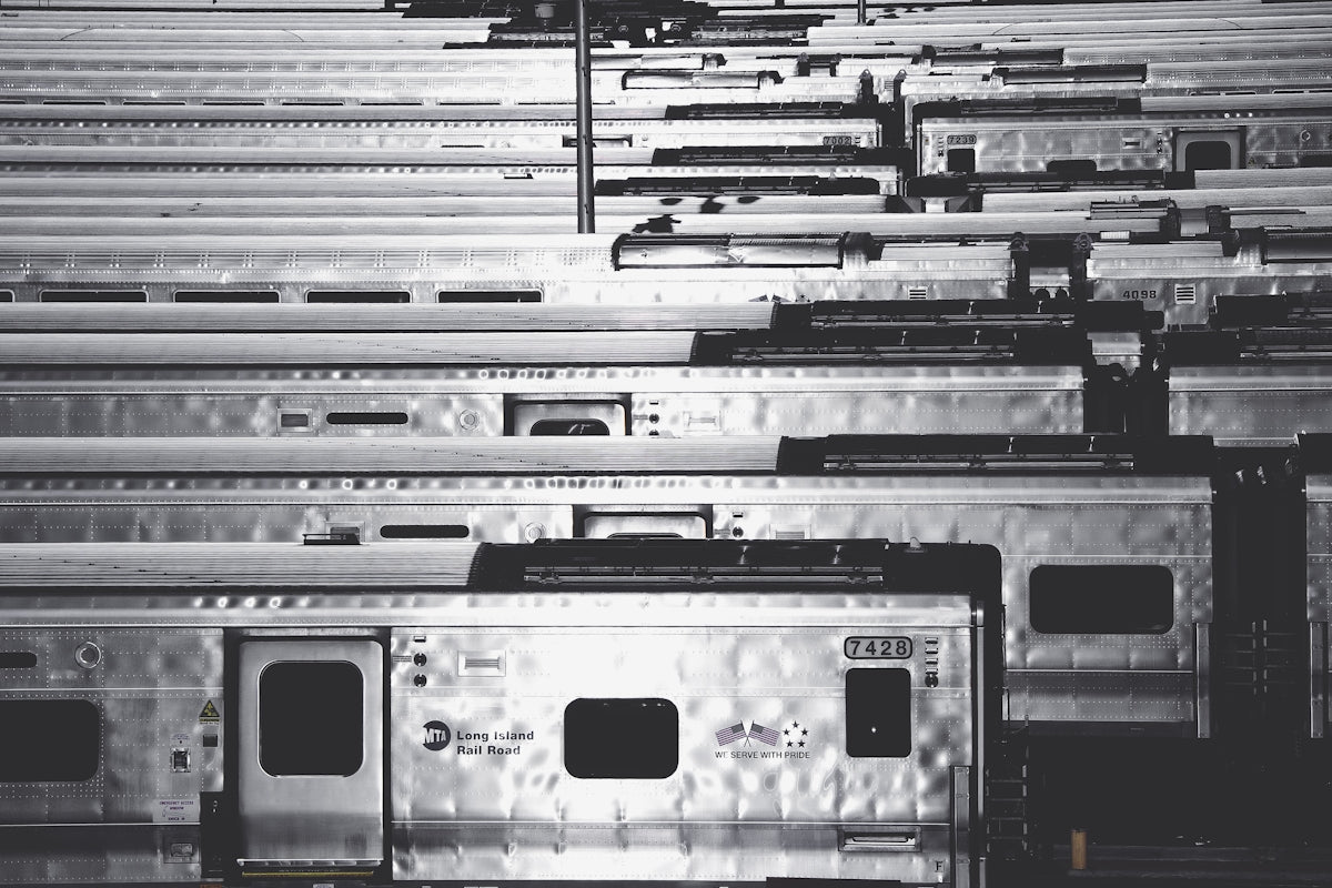 a bunch of train cars that are parked together