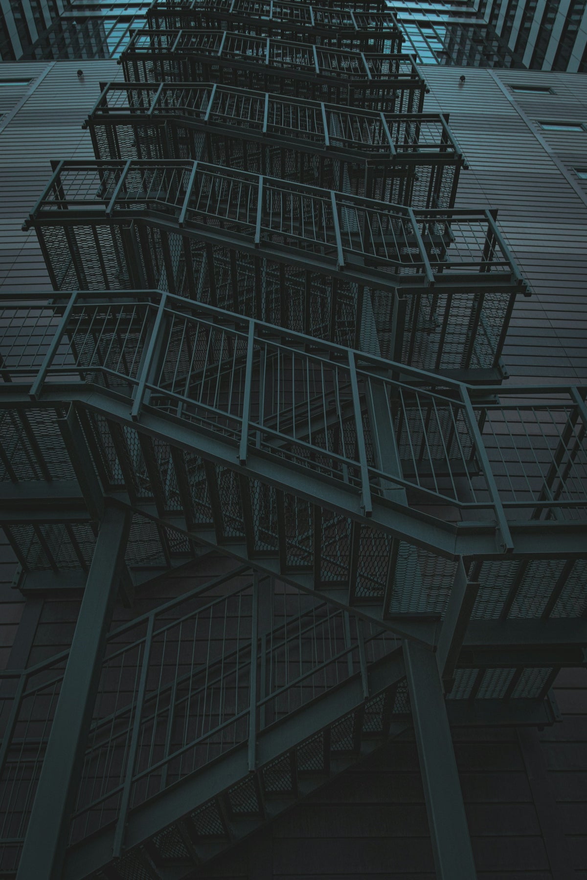 gray metal ladder on gray concrete wall