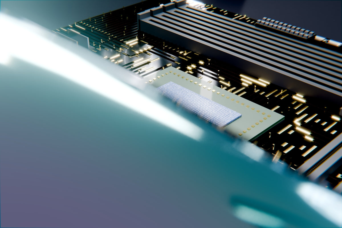 Computer motherboard with cpu and ram under bright light.